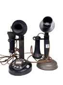 Two vintage stick telephones.