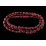 Cherry amber necklace, 180cm length, 153 grams.