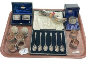 Silver napkin rings including two pairs, six Art Deco teaspoons, two spice holders and EP flatware.