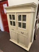 Painted scullery cabinet having two glazed panel doors above two drawers with two cupboard doors