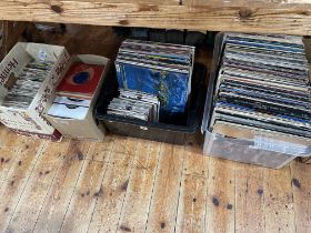 Four boxes of LP and single records including Bruce Springsteen, Queen, etc.