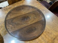 Rosewood circular Lazy Susan with pierced brass gallery, 61cm.