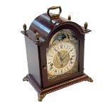 Mahogany mantel clock with brass mounts and Franz Hermle, West Germany striking movement,