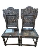 Pair Victorian carved oak armorial panel back hall chairs,