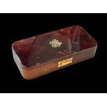 Gold mounted small tortoiseshell box, hinges hallmarked 9 carat, 11.25cm across.