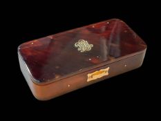 Gold mounted small tortoiseshell box, hinges hallmarked 9 carat, 11.25cm across.