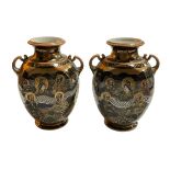 Pair of Japanese Satsuma two handled vases decorated with dragon and figures, 24cm.