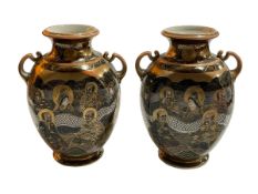 Pair of Japanese Satsuma two handled vases decorated with dragon and figures, 24cm.