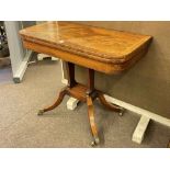 Victorian mahogany crossbanded fold top tea table raised on twin pillars to splayed legs,