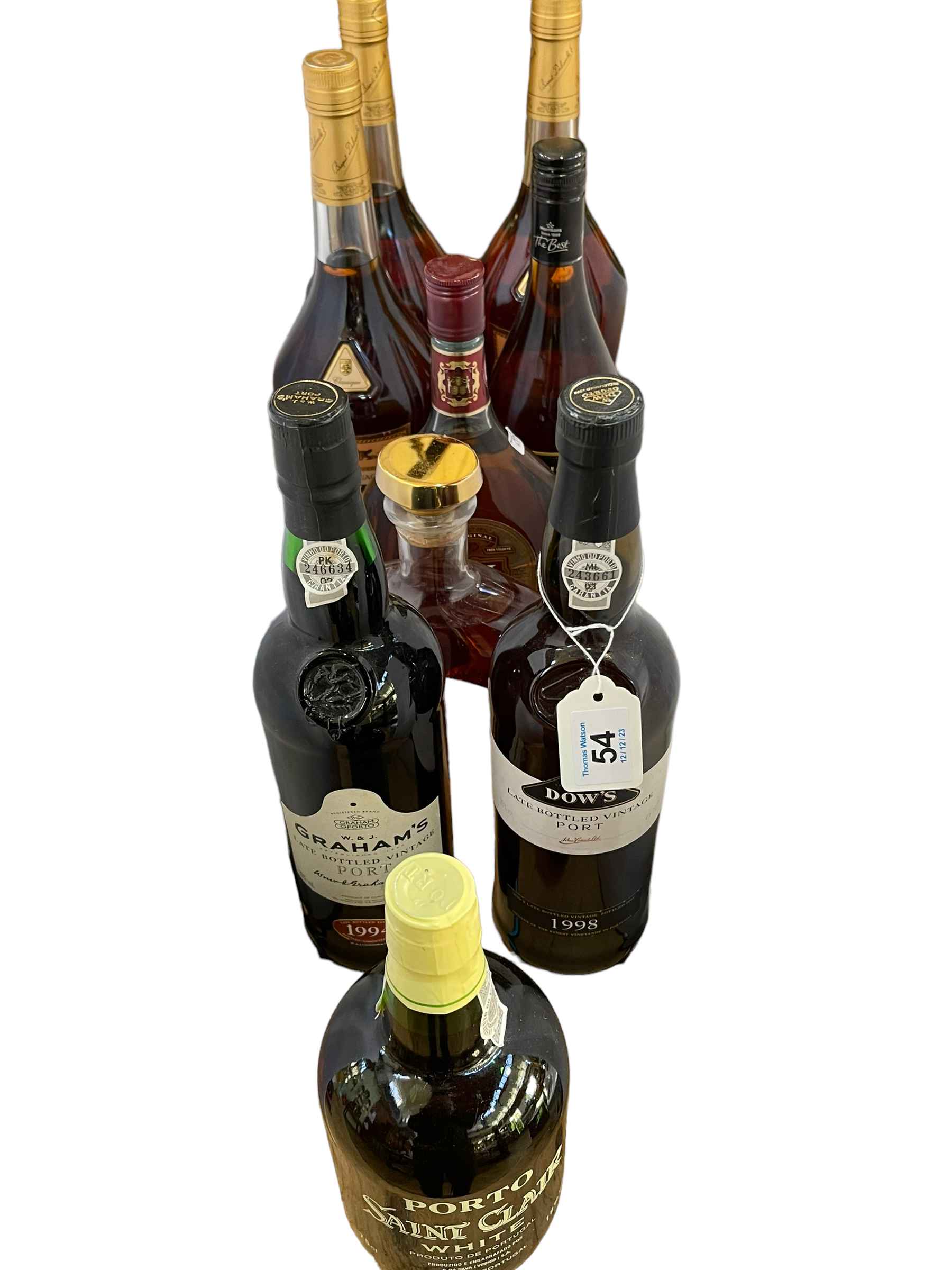 Nine bottles of spirits and wine including Domaine Tariquet 700ml, Bisquit Cognac 100cl,