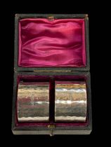 Pair hammered silver napkin rings in fitted case, London 1905. *Sold for the 100% benefit of St.
