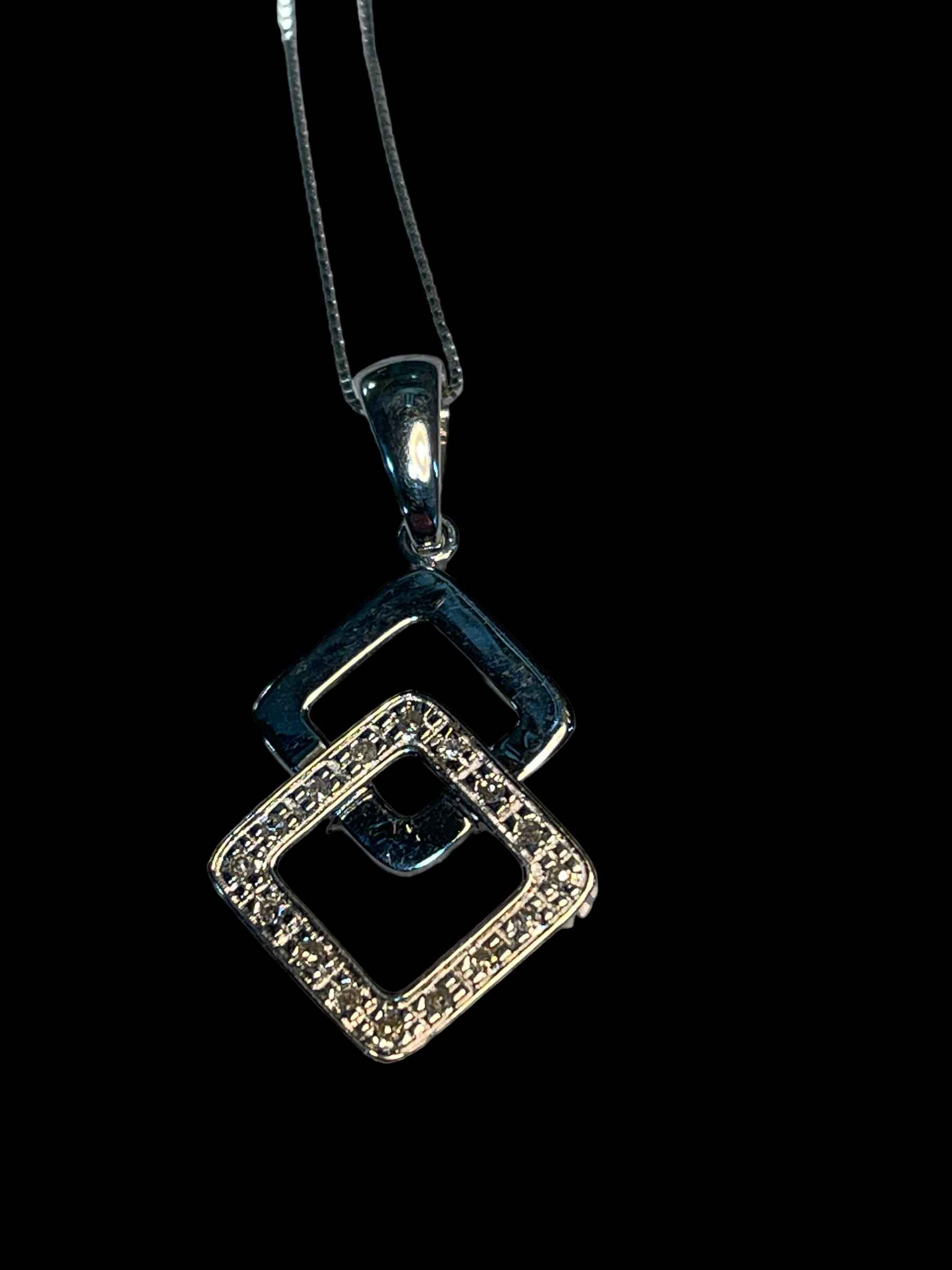 9 carat white gold and diamond pendant and chain.