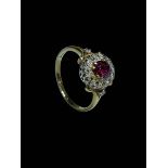 Ruby and diamond cluster 18 carat gold ring, size O/P.