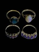 Four 9 carat gold rings including amethyst and opal.