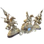 Large three piece ornate gilt metal clock garniture each mounted with knights on horseback.