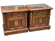 Pair Oriental carved hardwood two door pedestal cabinets, 66cm by 61cm by 45.5cm.