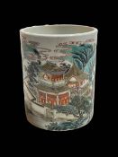 Chinese cylindrical brush pot decorated with village scene, iron red mark to base, 13.5cm high.
