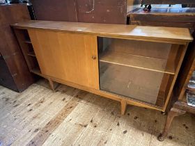 Mid Century teak low sliding door bookcase, 76.5cm by 155cm by 28cm.