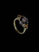 9 carat yellow gold smokey quartz three stone ring, size O.