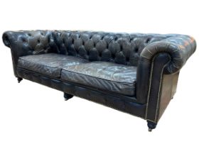Halo black deep buttoned leather and studded Chesterfield settee, 77cm by 243cm by 95cm.