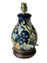 Modern Moorcroft Pottery table lamp with floral decoration.