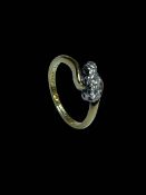 18 carat yellow gold and platinum set three stone diamond ring, size K.