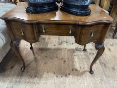 Oak shaped front three drawer dressing/writing table, 77.5cm by 102.5cm by 55cm.