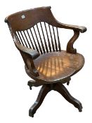Early 20th Century oak swivel office desk chair.