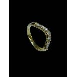 Seven stone diamond wishbone design ring set in 18 carat yellow gold, size S.