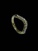 Seven stone diamond wishbone design ring set in 18 carat yellow gold, size S.