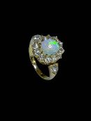 Opal and diamond 18 carat gold ring,