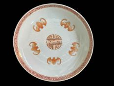 Chinese shallow dish decorated with bat design, iron red Danguang stamp to base, 21cm diameter.