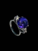 Impressive tanzanite and diamonds three stone ring set in 18 carat white gold,