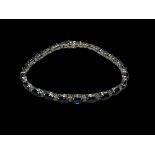 Sapphire and diamond bracelet set in 18 carat white gold, the sapphires totalling over 14 carats,