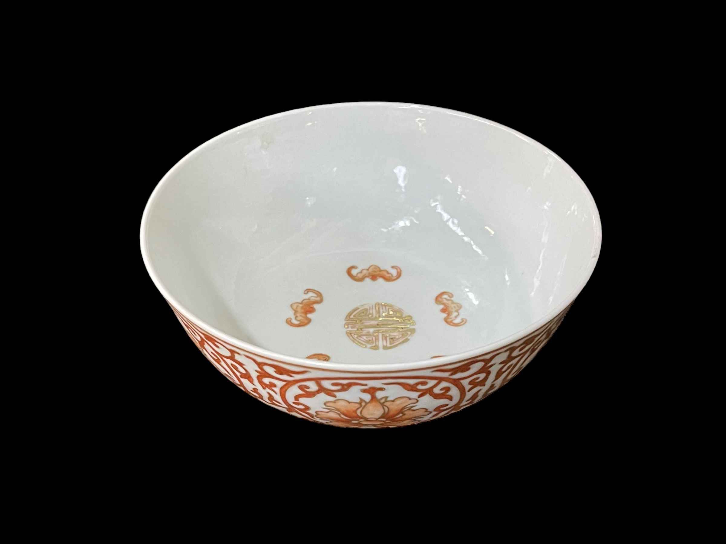 Chinese pottery bowl decorated with external floral pattern and internal bats,