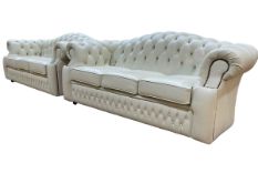 Ivory deep buttoned leather and studded four piece lounge suite comprising pair three seater