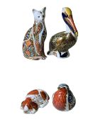 Four Royal Crown Derby paperweights inc Brown Pelican and Puppy.