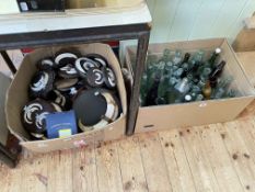 Collection of mounted Wild Boar and Warthog tusks and vintage glass bottles.