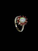 Opal and garnet cluster ring set in 9 carat yellow gold, size N.