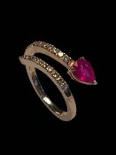 14 carat yellow gold, ruby and diamond snake design ring, size N.