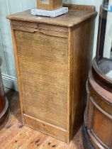 Early 20th Century oak filing cabinet, the roller shutter front enclosing nine drawers, 97cm by 48.