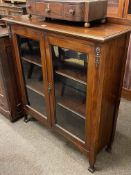 Edwardian mahogany glazed two door bookcase, 109.5cm by 96cm by 34cm.