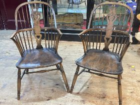 Pair Windsor pierced splat back elbow chairs.