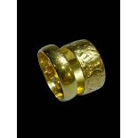 Two 22 carat gold wedding band rings.