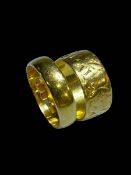 Two 22 carat gold wedding band rings.