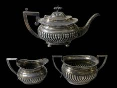 Three piece silver part fluted tea set, teapot Birmingham 1901, sugar and milk, Birmingham 1904.