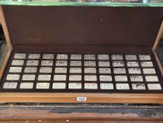 A cased collection of fifty 20th Century sterling silver proof ingots,