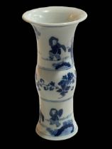 Chinese blue and white waisted vase decorated with figures and floral design, 22cm.