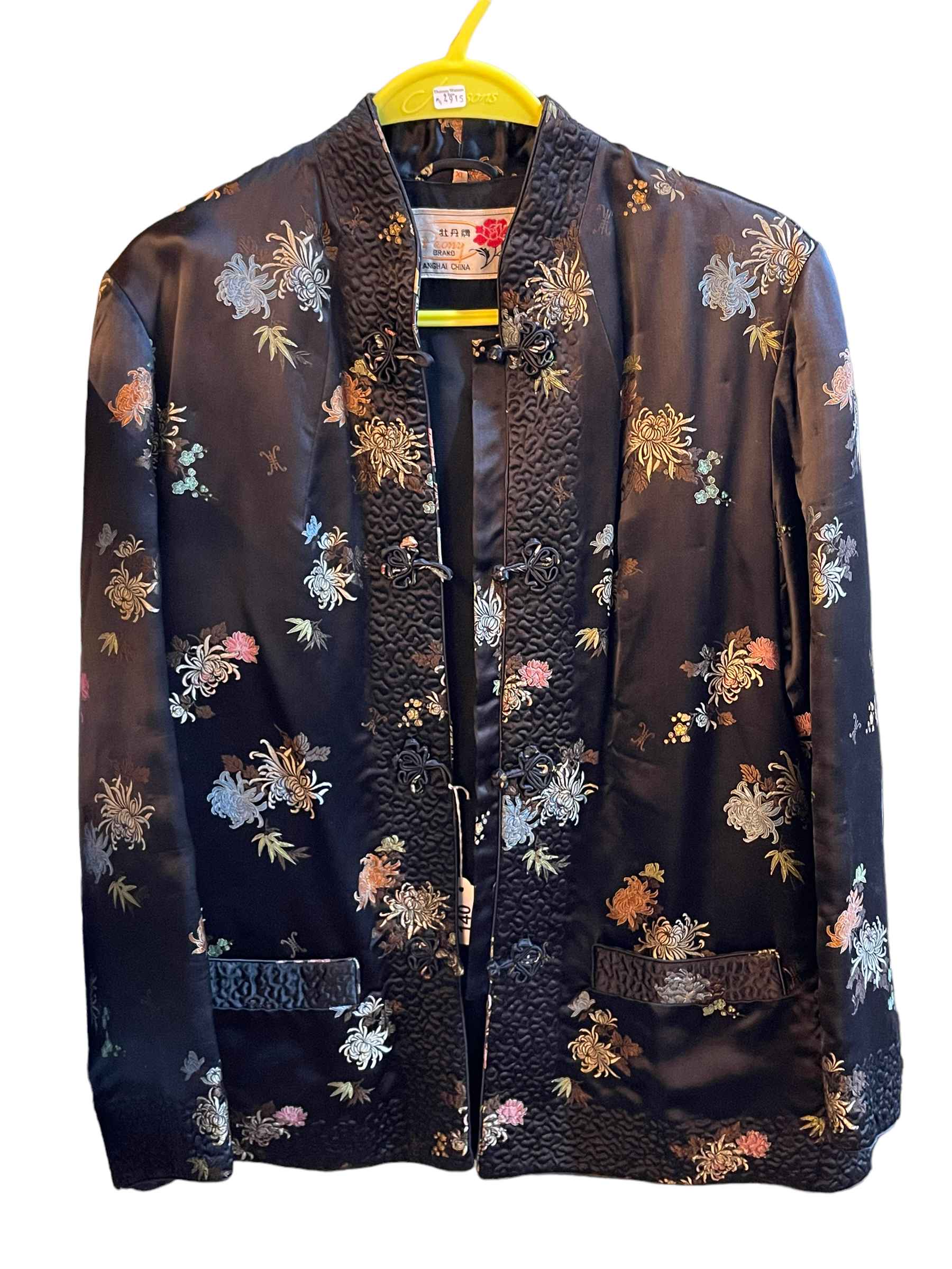 Oriental embroidered jacket with label reading 'Peony Brand Shanghai China'.