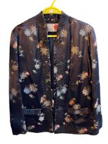 Oriental embroidered jacket with label reading 'Peony Brand Shanghai China'.